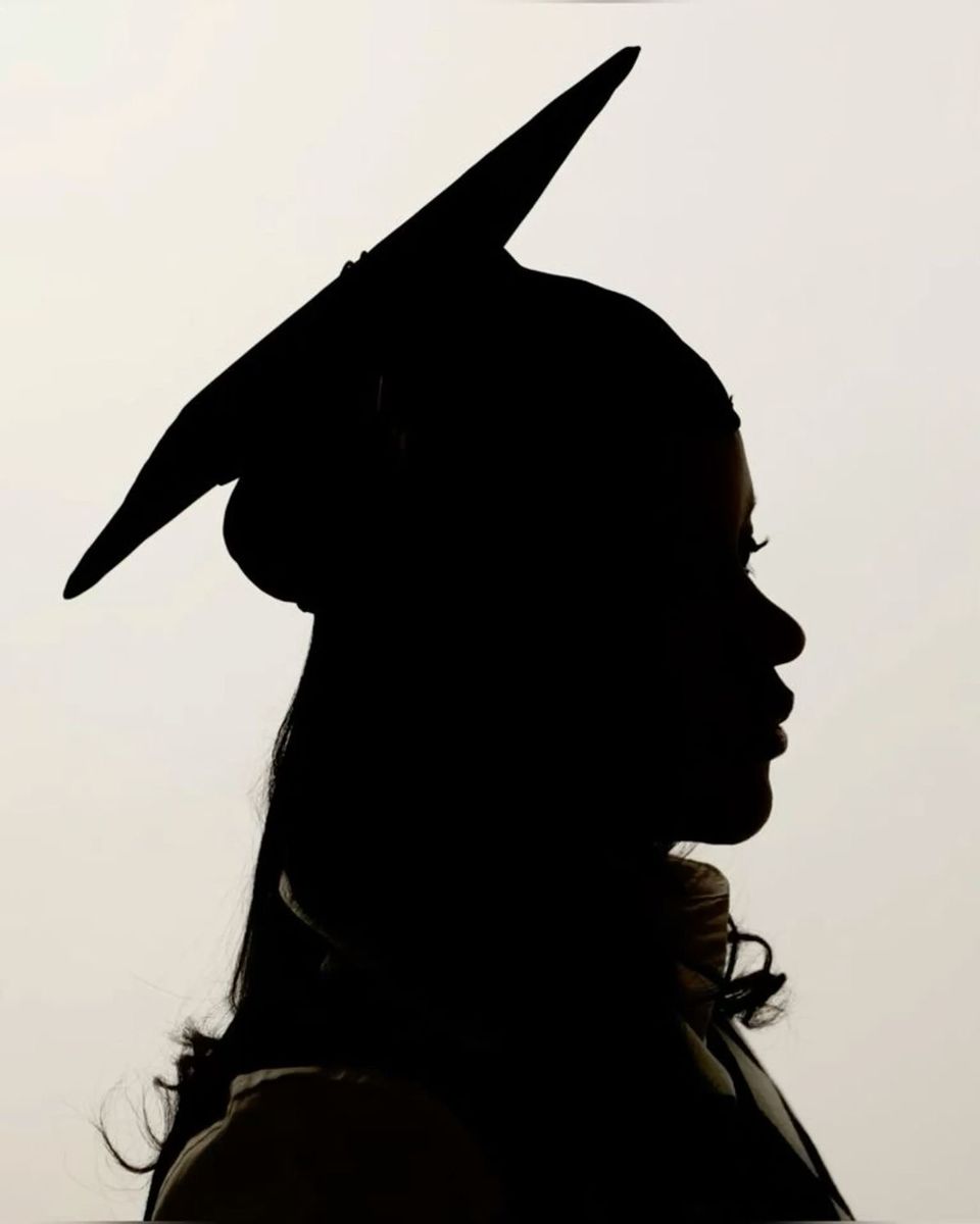 Silhouette of a graduate in cap and gown